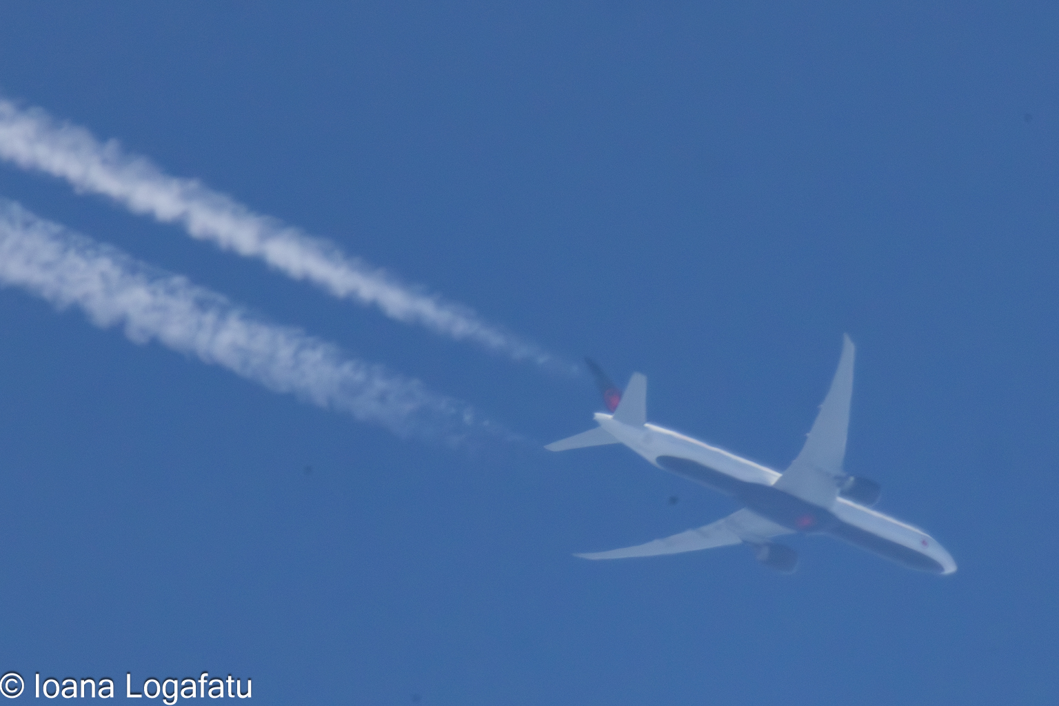 High above the clouds, a plane leaves its mark